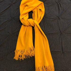Mustard yellow scarf.